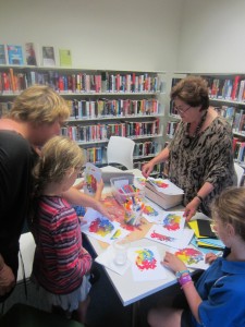 Ann running a painting class at Woollahra library. Image by Woollahra Library. 